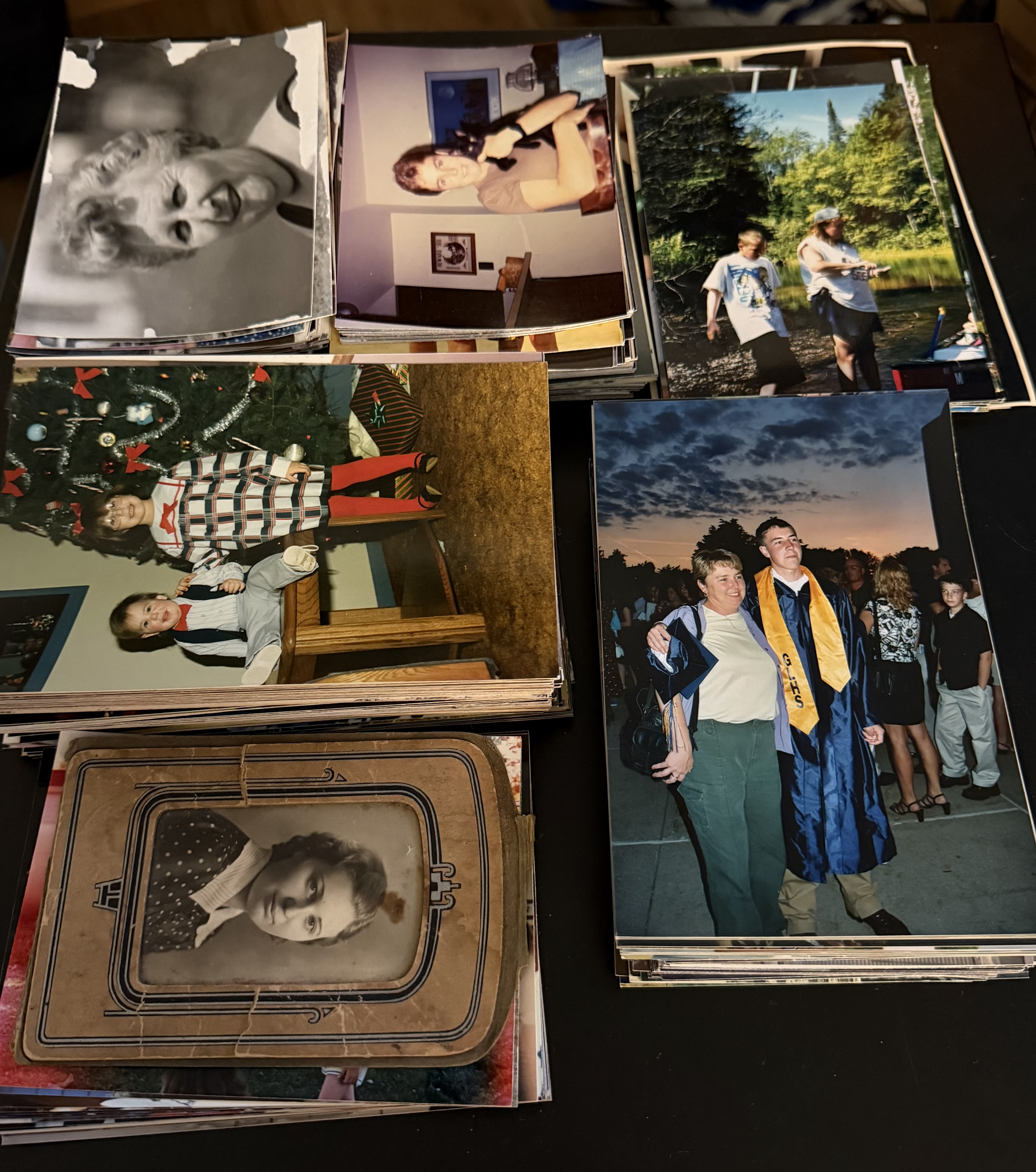 Stack of family photo prints ready for scanning